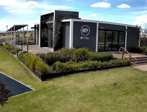 Construction site camera installed outside modern building for project monitoring